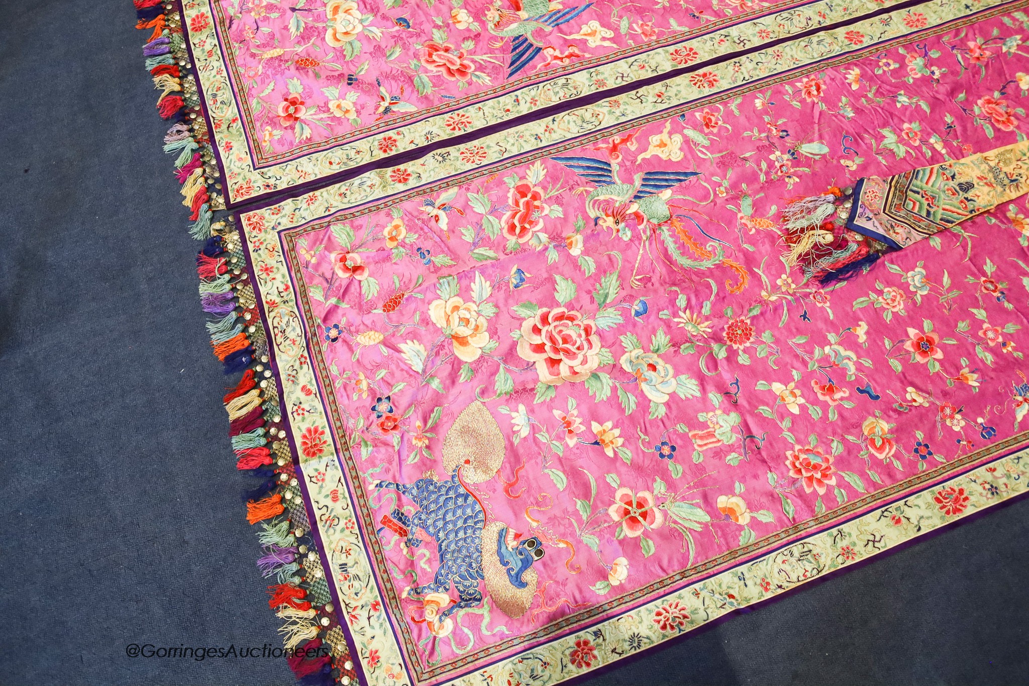 A pair of 20th century Chinese silk embroidered ceremonial panels, possibly for a wedding, 228cm not including fringing, each panel width 80cm, with a matching pelmet, width 198cm